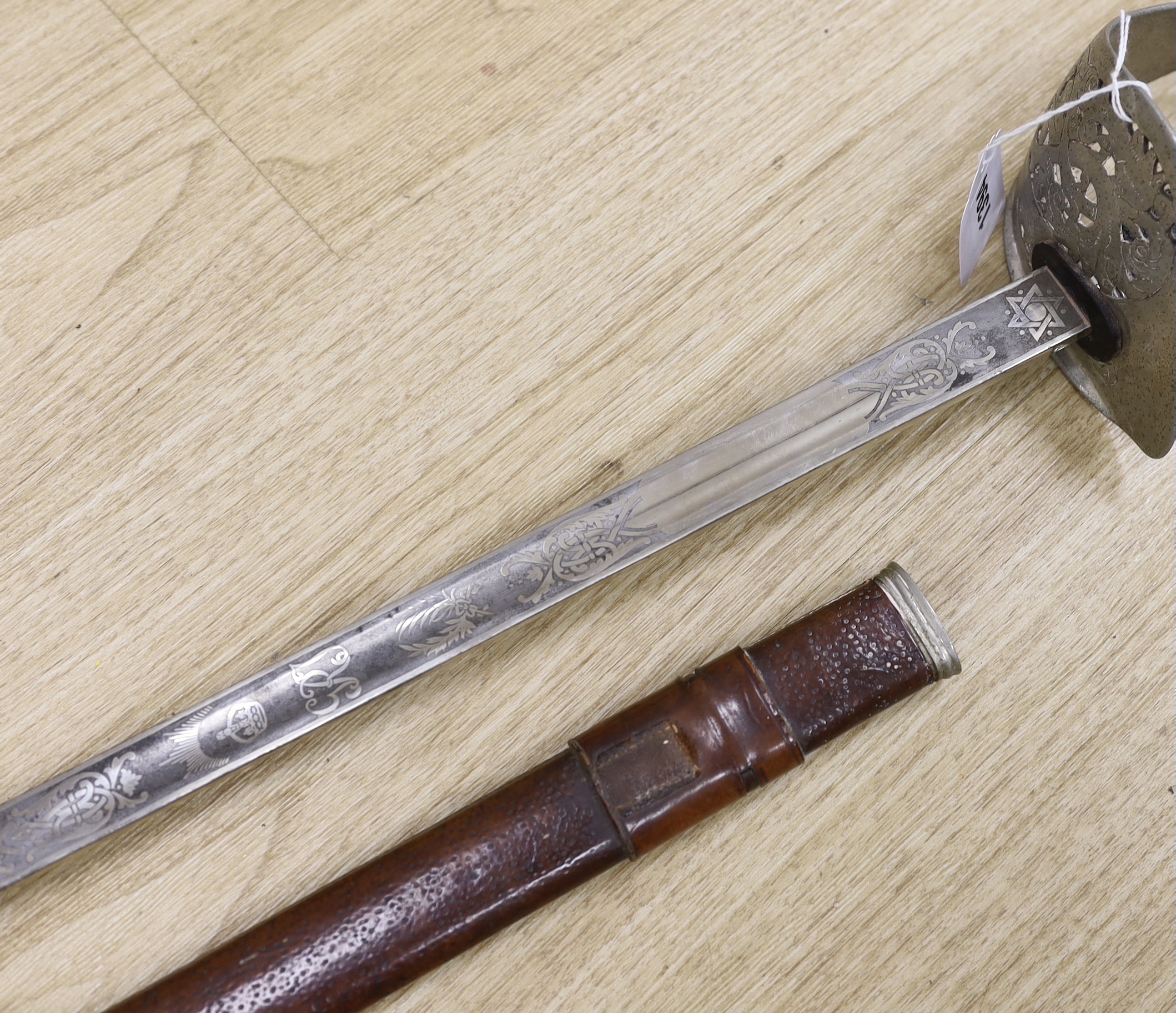 A George V officer's dress sword by Army & Navy Stores Ltd., blade 83cm, within leather scabbard